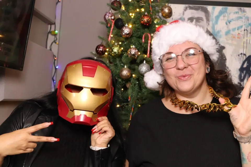Two guests in festive costumes at a past bar crawl